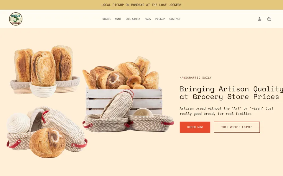 The Uncle J's Sourdough home page, with loaves of bread and a bread basket